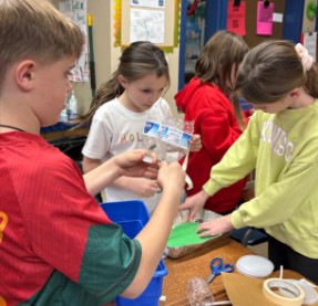  students work together to construct a flood resistant structure